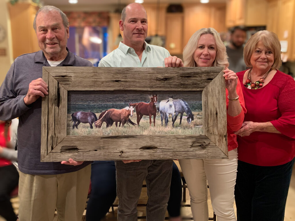 Elated customer with custom made barnwood frame and wild mustangs print - Randy G. Barney Photography