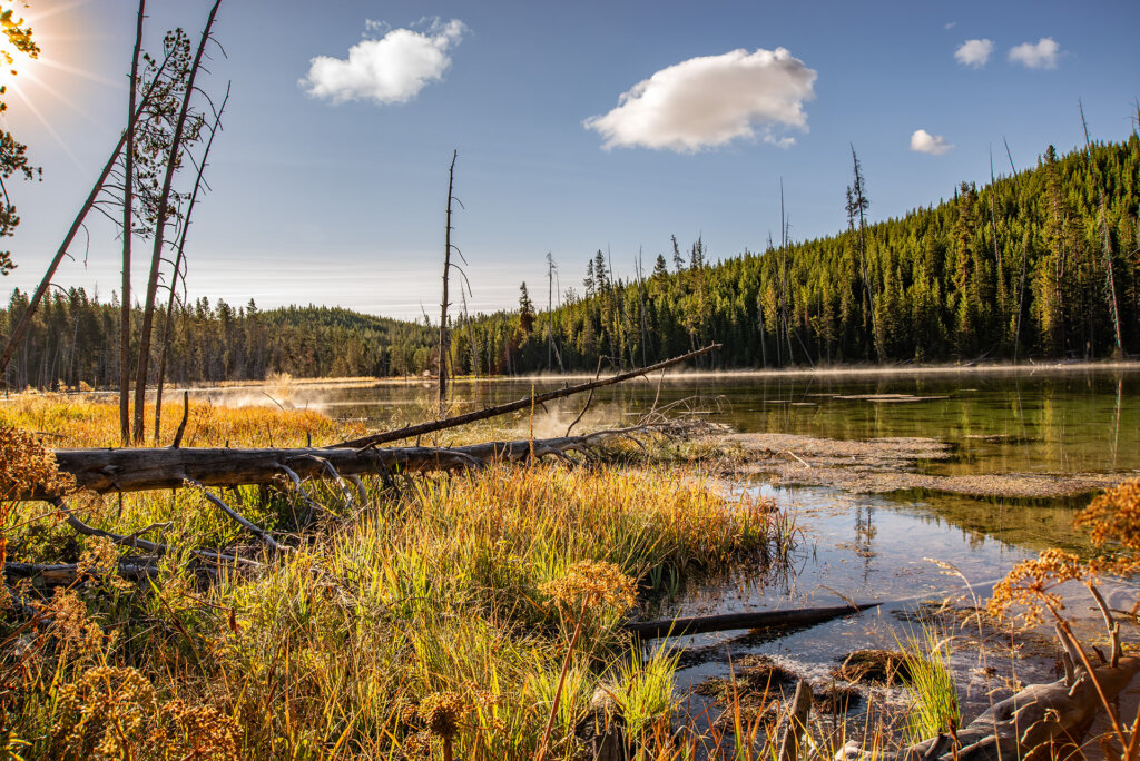 Yellowstone lake with morning mist rising off the water - Copyright Randy G. Barney Photography