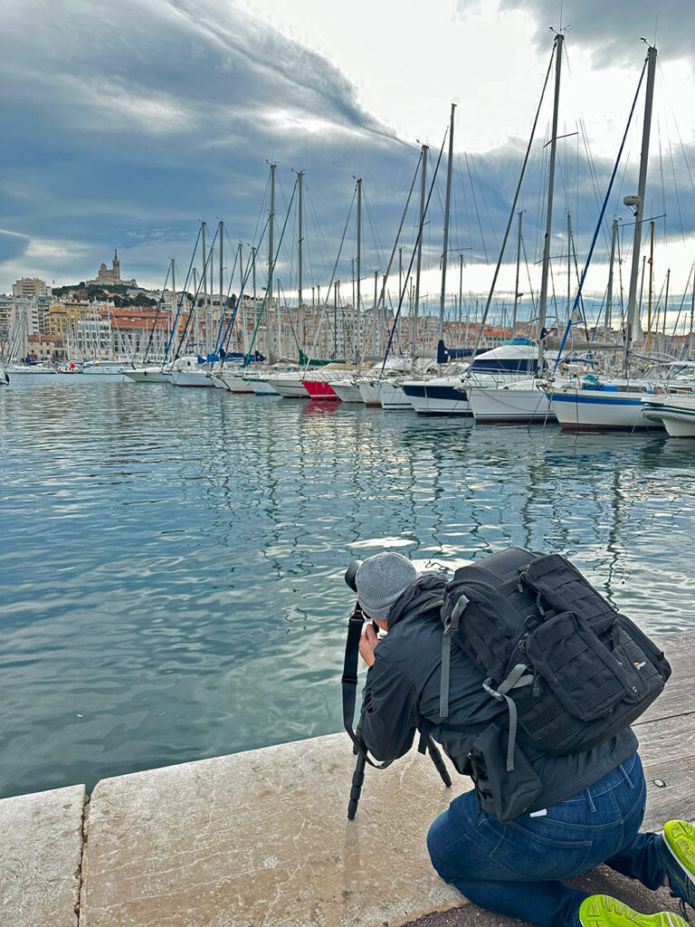 Randy G. Barney capturing an image with the marina in Marseille as foreground.