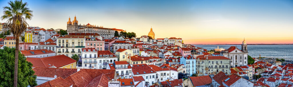 An awe inspiring view at sunset over the old town Alfama in Lisbon Portugal - Copyright Randy G Barney Photography.