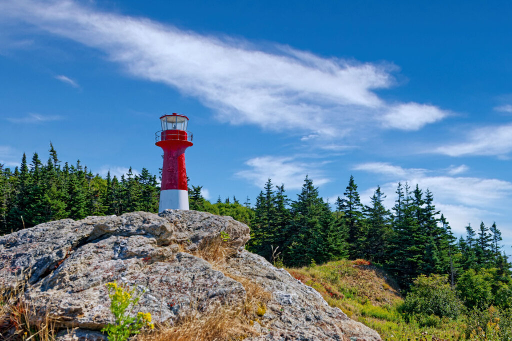 Standing tall on the mountainside, the Cape Spencer Lighthouse overlooks the Bay of Fundy near Saint John, New Brunswick Canada - Copyright Randy G. Barney